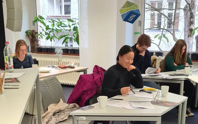 Participants at a writing workshop in the TUMJA office